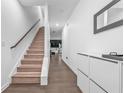 Inviting entryway features a staircase and modern storage creating a functional and stylish space at 5668 Union Pointe Dr, Union City, GA 30291