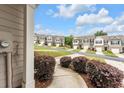 Street view of townhomes showcases a well-maintained community with attractive curb appeal and landscaping at 5668 Union Pointe Dr, Union City, GA 30291