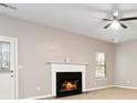 Bright living room with fireplace, neutral walls, and ceiling fan at 4783 Creekside Pl, Decatur, GA 30035