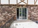 Spacious back porch with brick surround, sliding glass door, and railing at 1175 Church St # B, Decatur, GA 30030