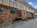Attractive exterior of a multi-unit brick building with stairs leading to the entrance at 1175 Church St # B, Decatur, GA 30030