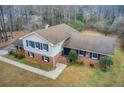 Aerial view of the brick home showing the classic design and well maintained landscaping on an ample lot at 2270 Old Concord Se Dr, Covington, GA 30016