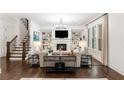 Bright living room with fireplace, built-in shelving, and large windows offering natural light at 281 Green Hill Rd, Atlanta, GA 30342