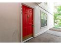 Image of a striking red front door with modern hardware and house numbers at 1201 Old Hammond, Atlanta, GA 30350