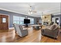 Spacious living room featuring hardwood floors, stone fireplace, and neutral paint colors at 2371 Leguin Mill Rd, Locust Grove, GA 30248