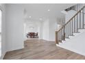 Spacious entryway that leads to the dining room and staircase to the upper level at 4865 Chesterfield Ct, Suwanee, GA 30024
