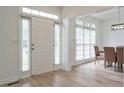 Bright foyer with beautiful floors and natural light streaming through the windows at 4865 Chesterfield Ct, Suwanee, GA 30024