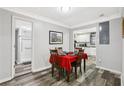 Cozy dining area with wood floors, seating for four, and a view into the kitchen at 2860 Jefferson St, Austell, GA 30106