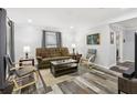 Bright living room with wood-look floors, comfortable seating, and neutral decor at 2860 Jefferson St, Austell, GA 30106