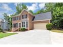 Charming two-story brick home with well-manicured lawn and attached two-car garage at 4810 Habersham Se Way, Conyers, GA 30094