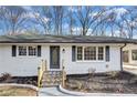 Attractive single-story brick home with black shutters and a covered carport at 5774 Forest Dr, Acworth, GA 30102