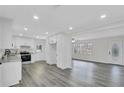 Bright kitchen with white cabinets, granite countertops, and stainless steel appliances at 5774 Forest Dr, Acworth, GA 30102