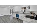 Modern kitchen with white cabinets, granite countertops, and stainless steel appliances at 5774 Forest Dr, Acworth, GA 30102