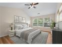 Serene main bedroom with vaulted ceilings, large windows, and neutral decor at 153 Towey Trl, Woodstock, GA 30188