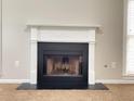 Living room with a classic white fireplace and windows with blinds for natural lighting at 690 Kimball Parc Way, Alpharetta, GA 30022