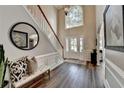 Grand foyer with hardwood floors, high ceilings, and elegant staircase at 2633 Hanriva Ct, Dacula, GA 30019