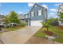 Attractive home with a spacious driveway, well-maintained lawn, and welcoming front porch at 3699 Broadwick Ln, Lithonia, GA 30038