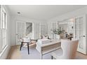 Bright home office featuring French doors, designer desk and decor, and plenty of natural light at 600 Delphinium Nw Blvd, Acworth, GA 30102