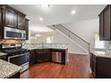 Well-equipped kitchen boasts stainless steel appliances, granite countertops, and abundant cabinet space at 2366 Proctor Creek Enclave, Acworth, GA 30101