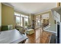 Spacious living room with hardwood floors, large windows, and seamless flow into the foyer at 3410 Kates Way, Duluth, GA 30097