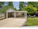 Backyard pergola with a fire pit area with seating, perfect for relaxing and entertaining at 1168 Mclynn Ne Ave, Atlanta, GA 30306