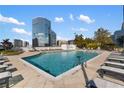 Outdoor pool with lounge seating and city views for residents enjoyment at 3324 Peachtree Ne Rd # 1813, Atlanta, GA 30305