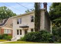 Stunning two-story home with a charming facade, well-maintained yard, and picturesque neighborhood setting at 851 Courtenay Ne Dr, Atlanta, GA 30306