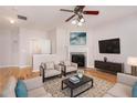 Bright living room with hardwood floors, fireplace, and modern furnishings at 1576 Thornwick Trce, Stockbridge, GA 30281