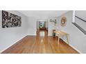 Spacious, bright living room with hardwood flooring and artwork on the wall at 1625 Clark Lake Nw Dr, Acworth, GA 30102