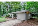 Side angle of home with a light neutral exterior and driveway at 1715 Lee St, Decatur, GA 30035