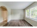 Bright living room with hardwood floors, freshly painted walls, and a large window at 1715 Lee St, Decatur, GA 30035