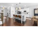 Modern kitchen featuring stainless steel appliances, granite countertops, and an island with seating at 178 Crestbrook Way, Dallas, GA 30157