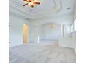 Spacious living room featuring recessed lights, large windows, and chandelier at 5004 Duxford Se Dr, Smyrna, GA 30082