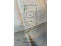 Survey displays lot lines, two story house with deck, and shows driveway and neighbors at 998 Northrope Ne Dr, Atlanta, GA 30324
