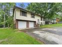 Classic split-level home with a two-car garage at 2501 Northbrook Rd, Snellville, GA 30039