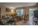Inviting living room with hardwood floors, comfortable seating, and natural light at 207 Walthall Nw St, Marietta, GA 30064