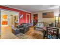 Cozy living room featuring hardwood floors, an American flag, and comfortable furniture at 207 Walthall Nw St, Marietta, GA 30064