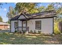 Charming single story home featuring a cozy covered entry porch and well-manicured lawn at 2776 Grand Ave, Atlanta, GA 30315