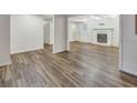 Spacious living room with fireplace, new hardwood flooring and freshly painted walls at 333 Lynne Cir, Alpharetta, GA 30009