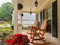 Charming front porch with rocking chairs and hanging plants at 2145 Kensington Sw Ct, Marietta, GA 30064