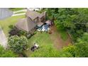 Spacious backyard with a patio area, lush greenery, and mature trees creating a private oasis at 425 Starfire Ct, Suwanee, GA 30024