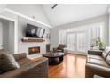 Bright and open living room featuring fireplace, hardwood floors, and natural light at 3280 Stillhouse Se Ln # 410, Atlanta, GA 30339