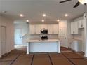 Bright, modern kitchen with white cabinets, stainless steel appliances, and center island at 3230 Cyrus Creek Dr, Kennesaw, GA 30152