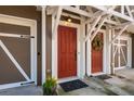Red front door with decorative wreath and a covered entrance at 380 Grant Se Cir # 110, Atlanta, GA 30315