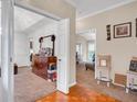Open living space with hardwood floors transitioning to carpet, adjacent to a dining area at 1574 Glenfield Dr, Lawrenceville, GA 30043