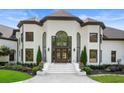 Elegant home showcasing the front door, manicured landscaping, and a grand entrance at 330 Longvue Ct, Johns Creek, GA 30097