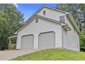 This charming home boasts a spacious two-car garage and impeccable siding and landscaping at 6402 Grafton Ct, Austell, GA 30168