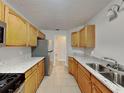 Kitchen featuring stainless steel appliances, granite countertops, and stainless steel sink at 115 Hugh Dr, Covington, GA 30016