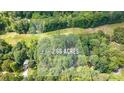Aerial view of a wooded lot, highlighting a 2.66 acre property at 1526 Oakleaf Dr, Auburn, GA 30011