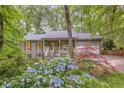 Two-story home featuring a welcoming front porch and an attached two-car garage at 1526 Oakleaf Dr, Auburn, GA 30011